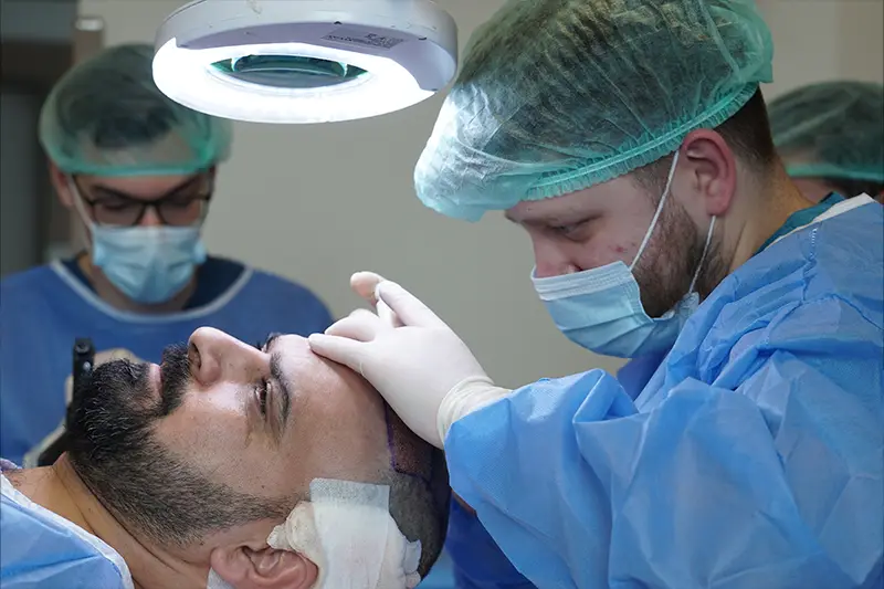 Hair graft implantation stage during hair transplant procedure